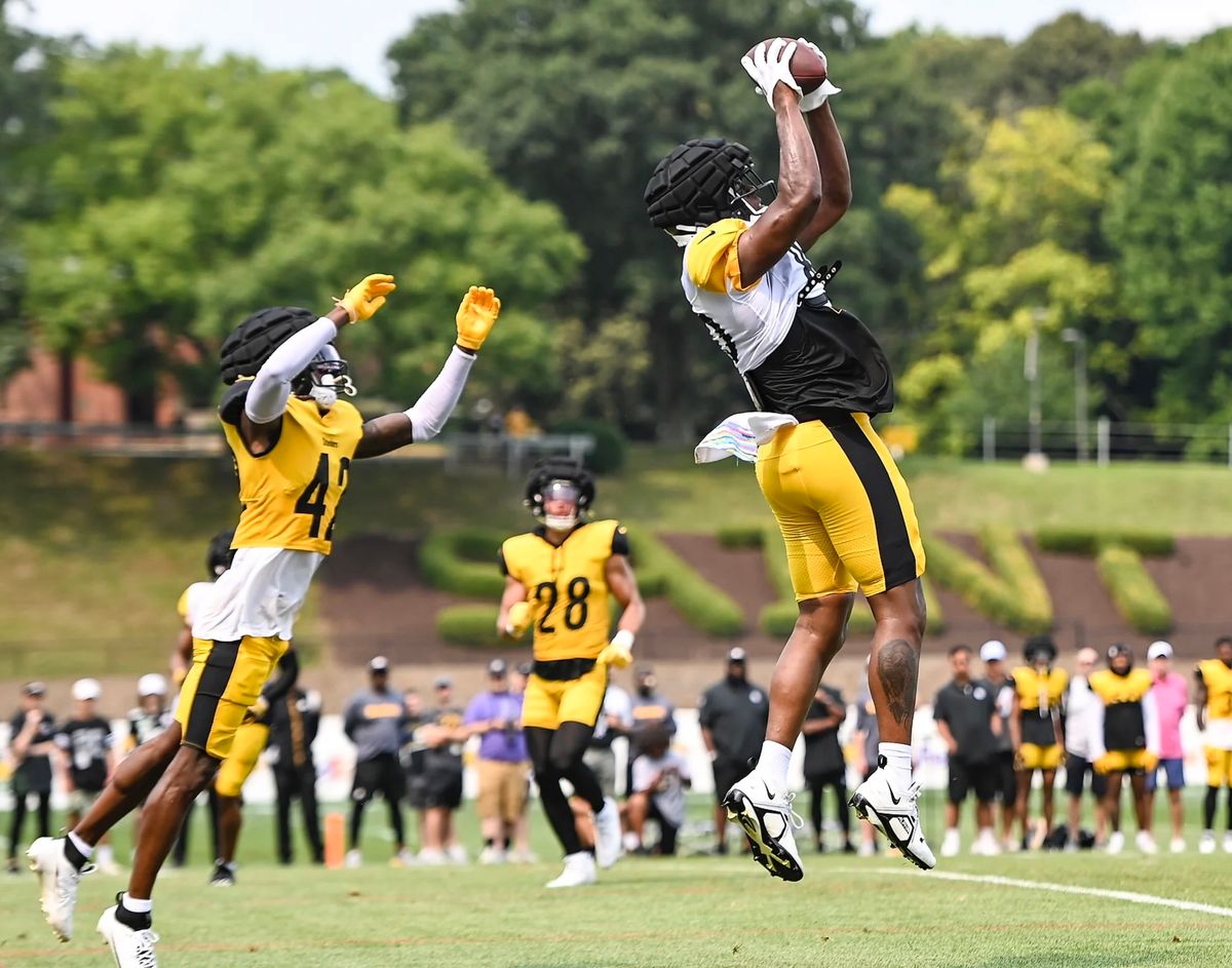 Darnell Washington catches a touchdown in front of James Pierre Tuesday in Latrobe, Pa.